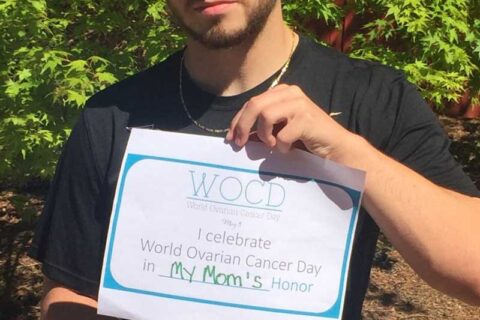 A man holding WOCD banner